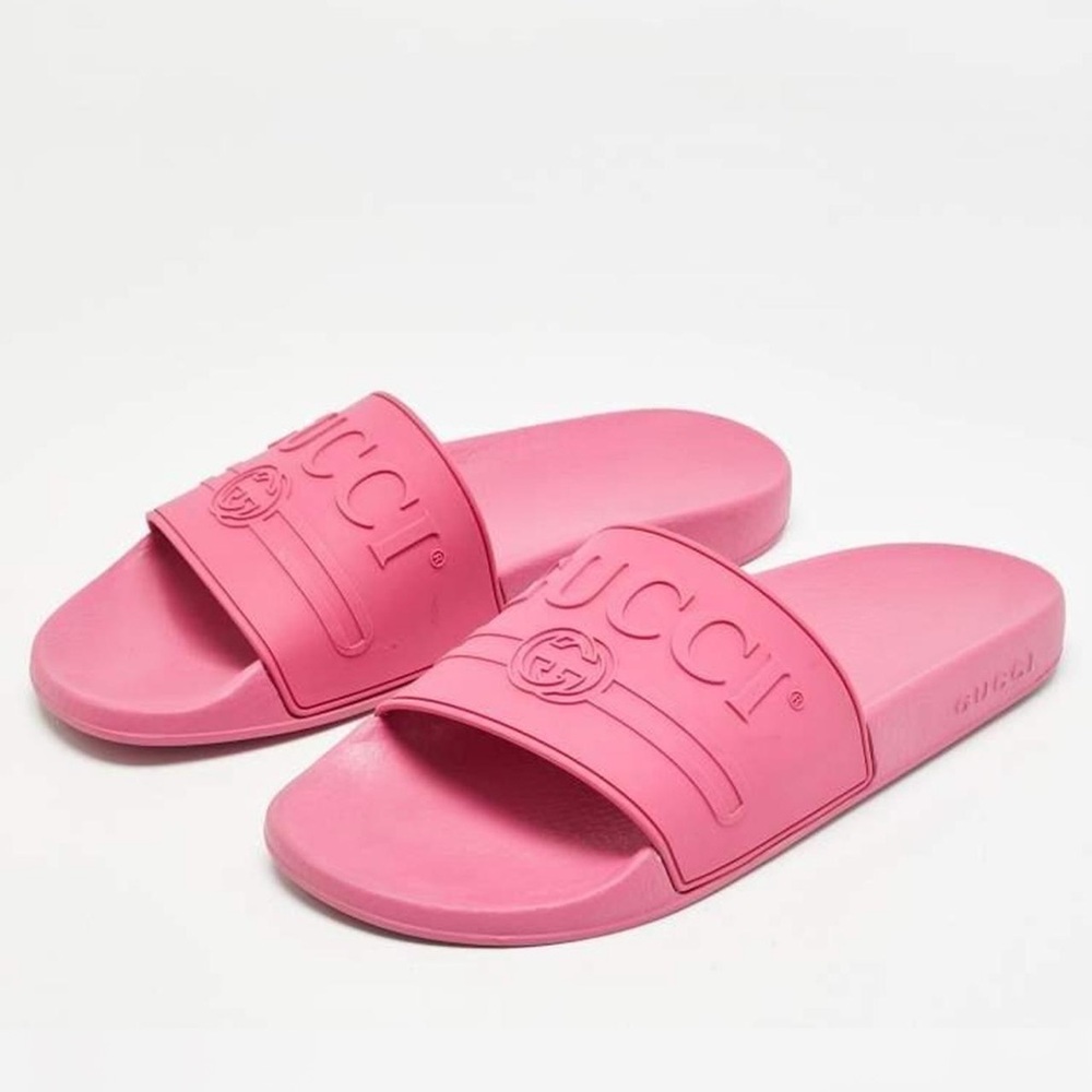 Pink gucci rubber logo slides